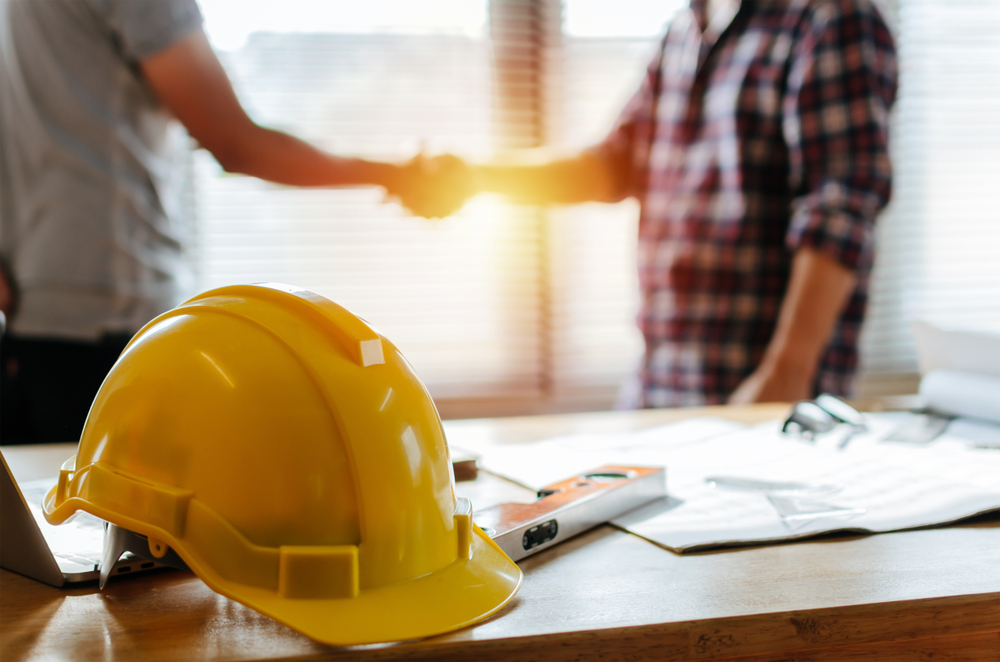 homeowner, real estate investor, contractor, shaking hands, construction site