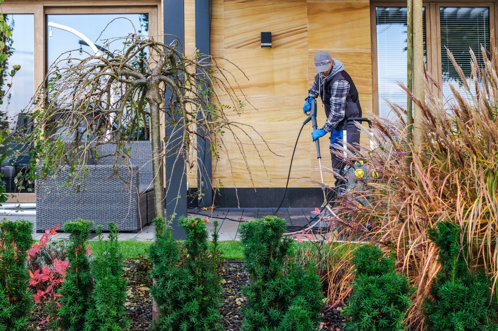 worker doing rental property maintenance, fall maintenance