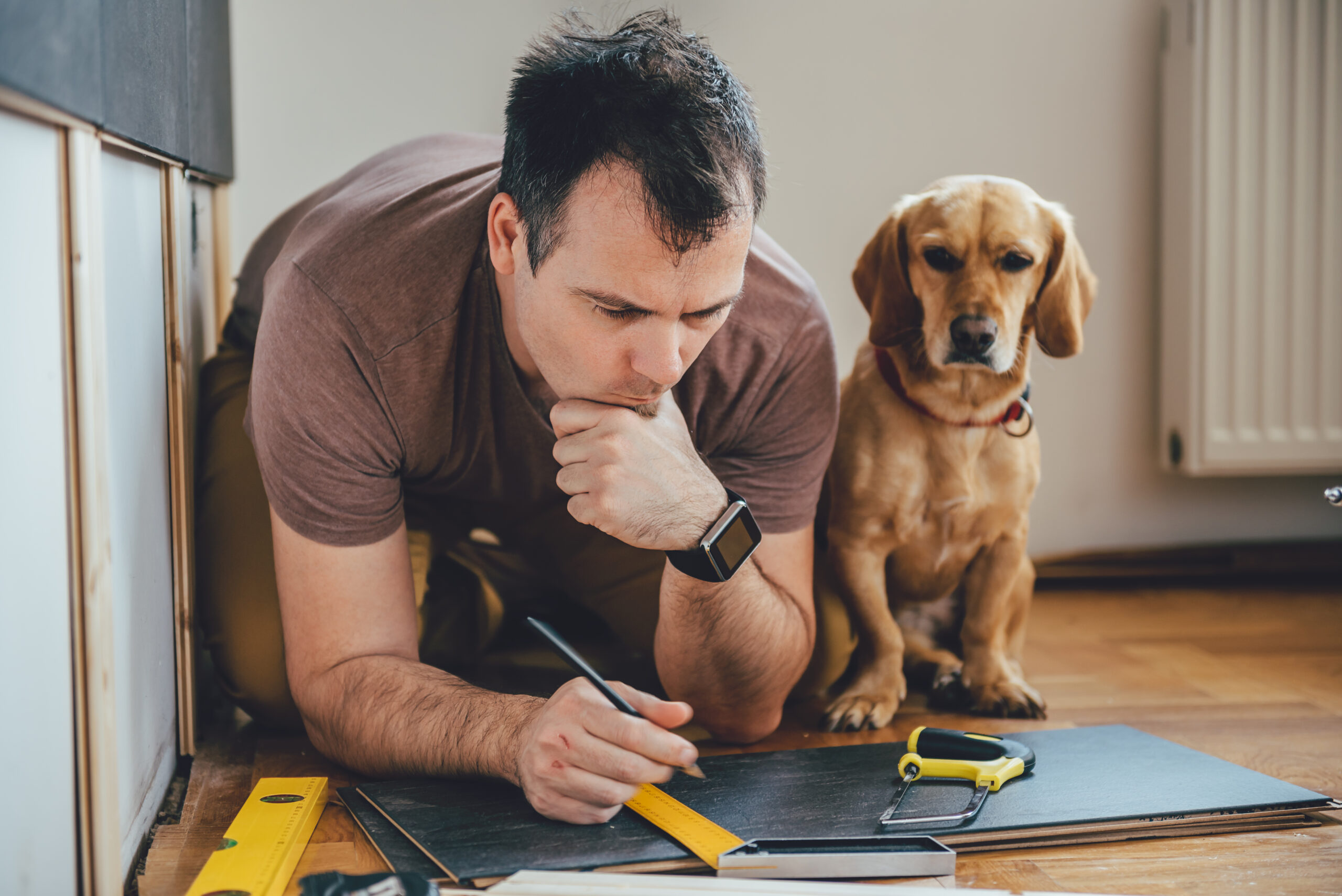 man with dog, home renovation, house flipper mistakes